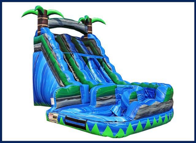 Colorful inflatable waterslide with palm trees for outdoor fun.