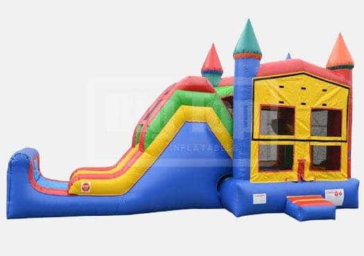 Vibrant inflatable castle bounce house with slide for children's parties.