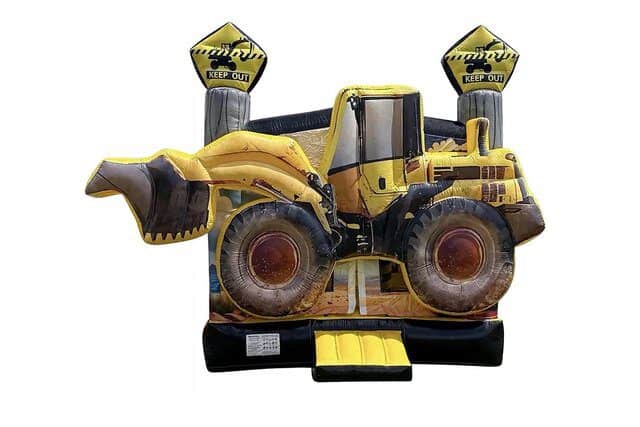 Yellow excavator-themed bounce house with safety signs for children.