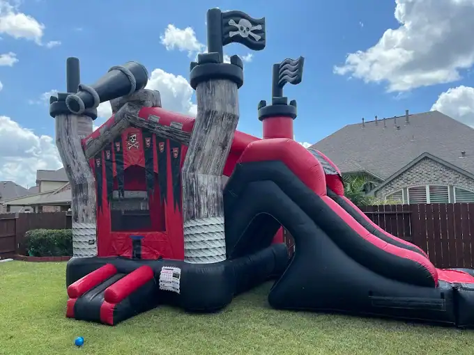 Pirate Water Slide Rental for Kids Inflatable pirate-themed water slide with slide and climbing area.