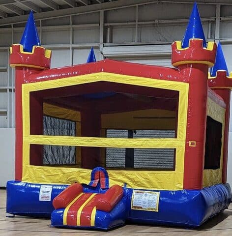 Vibrant inflatable castle bounce house for kids at Party Kids America.